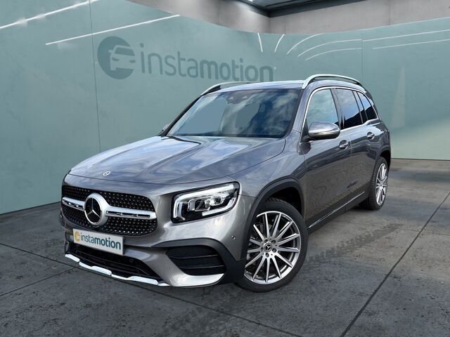Grau Gebraucht 2022 Mercedes GLB220 AMG line SUV | 60.980 € - Bild 1/2