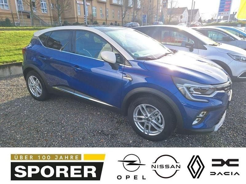 Blau (ironblau metallic/dach alabasterweiß) Gebraucht 2023 Renault Captur Iconic SUV | 23.990 € (Teuer) - Bild 1/4