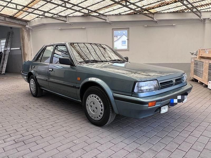 Grün Gebraucht 1988 Nissan Bluebird Limousine | 9.990 € - Bild 1/4