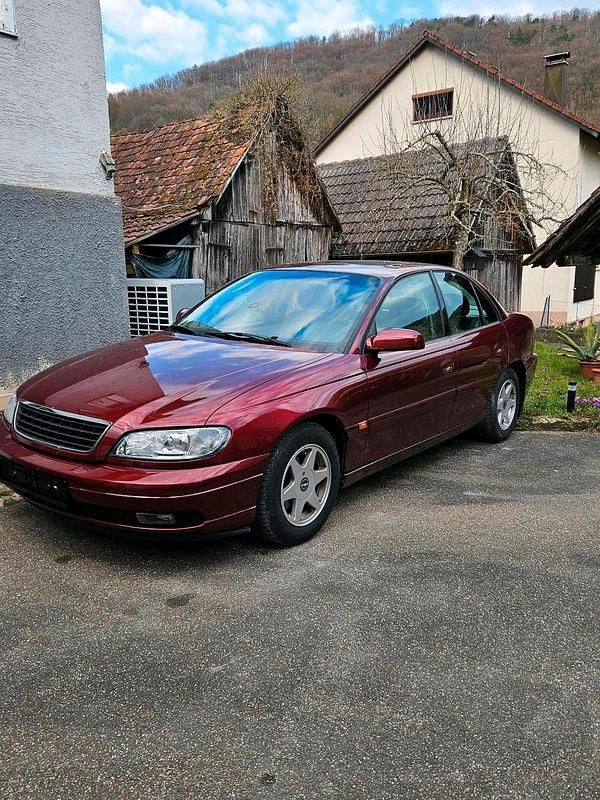Second-hand Opel Omega 170 CP (125 kW) 2000 Roșu Berlinǎ