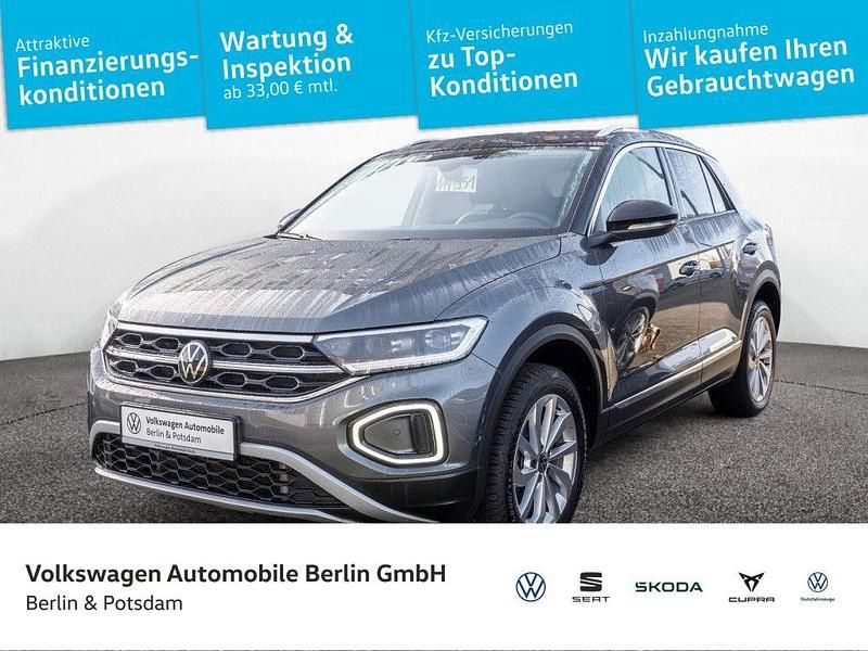 Indiumgrau metallic/schwarz Gebraucht 2024 VW T-Roc Style SUV | 29.990 € (Fairer Preis) - Bild 1/4