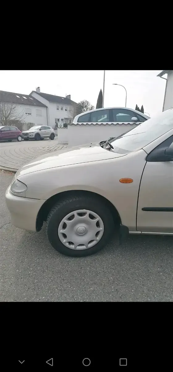 Second-hand Mazda 323 88 CP (64 kW) 1996 Bej Berlinǎ