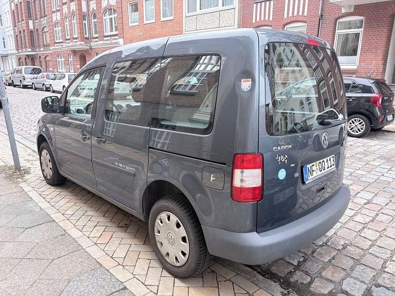 Second-hand VW Caddy Team 105 CP (77 kW) 2010 Gri Monovolum