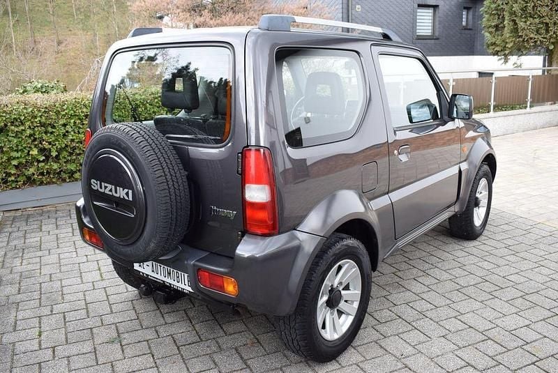 Usado Suzuki Jimny Style 86 HP (63 kW) 2012 Cinzento SUV