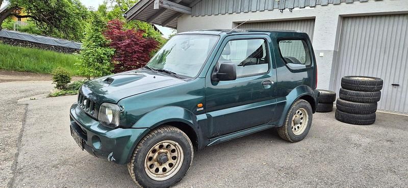 Grün Gebraucht 2005 Suzuki Jimny Comfort SUV | 5.200 € (Fairer Preis) - Bild 1/4