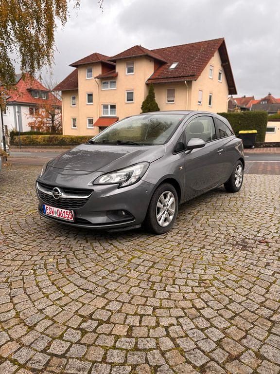 Grau Gebraucht 2015 Opel Corsa Edition Limousine | 5.590 € (Guter Preis) - Bild 1/4