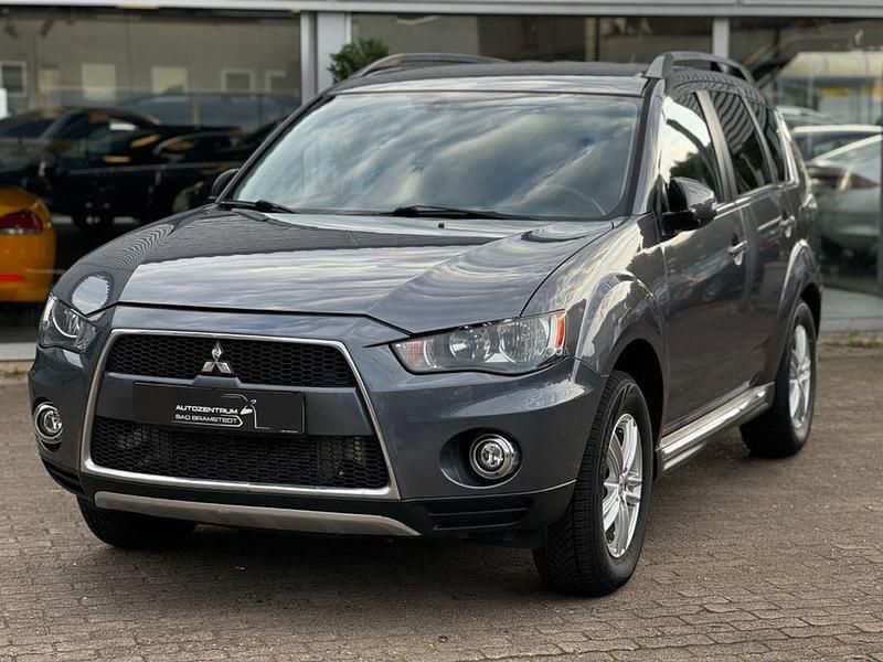 Grau Gebraucht 2012 Mitsubishi Outlander Motion SUV | 4.999 € (Fairer Preis) - Bild 1/4