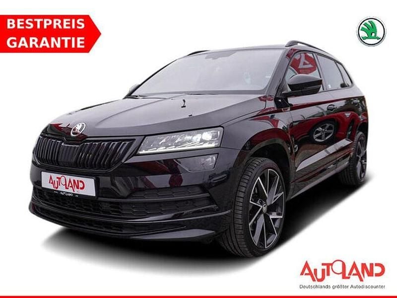 Schwarz Gebraucht 2021 Skoda Karoq SportLine SUV | 26.890 € (Etwas zu teuer) - Bild 1/4