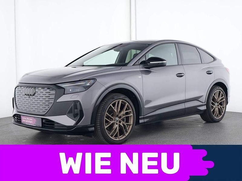 Grau Gebraucht 2022 Audi Q4 Sportback e-tron Sport SUV | 44.978 € - Bild 1/4