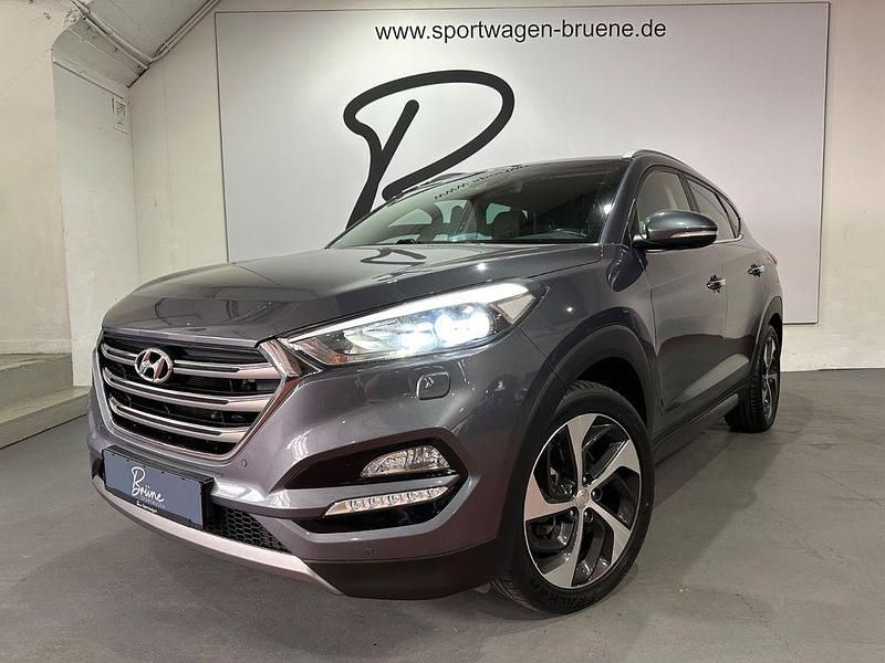Grau Gebraucht 2016 Hyundai Tucson Premium SUV | 17.900 € (Fairer Preis) - Bild 1/4