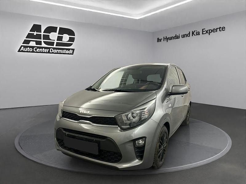 Astrograu (metallic) Gebraucht 2021 Kia Picanto DREAM-TEAM Edition Kleinwagen | 13.470 € (Etwas zu teuer) - Bild 1/4