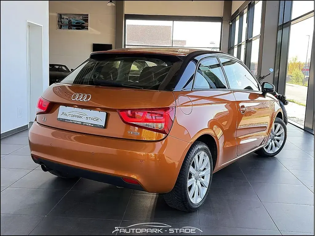 Second-hand Audi A1 Attraction 86 CP (63 kW) 2013 Portocaliu Hatchback