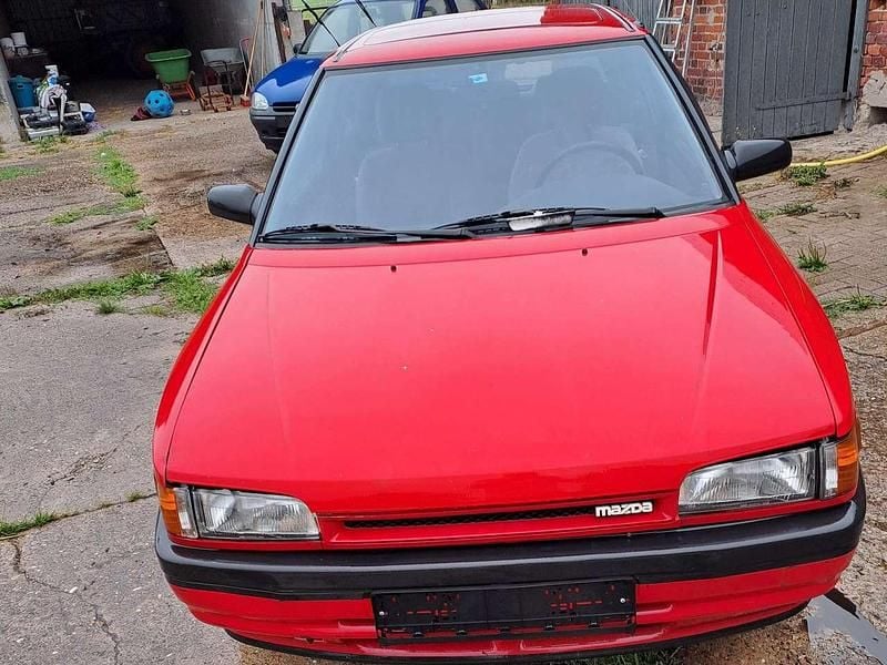 Gebraucht Mazda 323 84 PS (61 kW) 1991 Rot Limousine