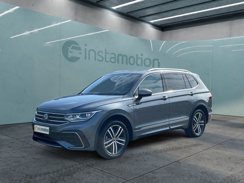 Grau Gebraucht 2024 VW Tiguan Allspace R-line SUV | 47.691 € (Fairer Preis) - Bild 1/4
