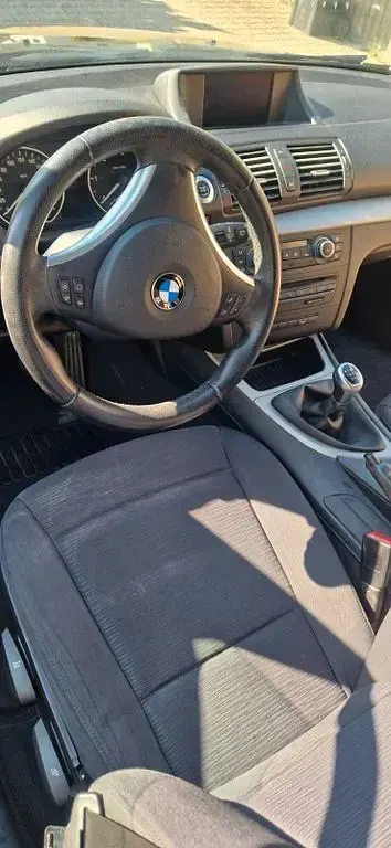 Second-hand BMW 118 143 CP (105 kW) 2009 Negru Hatchback
