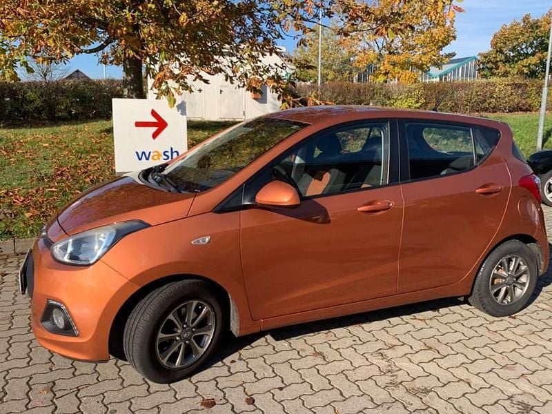 Orange Gebraucht 2013 Hyundai i10 Intro Edition Kleinwagen | 3.699 € (Guter Preis) - Bild 1/4
