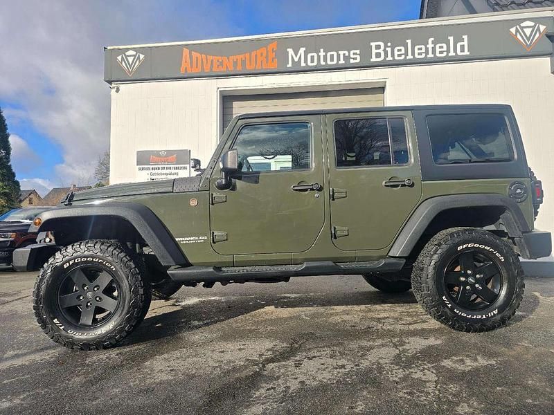 Grün Gebraucht 2015 Jeep Wrangler Unlimited Rubicon SUV | 38.900 € (Teuer) - Bild 1/4