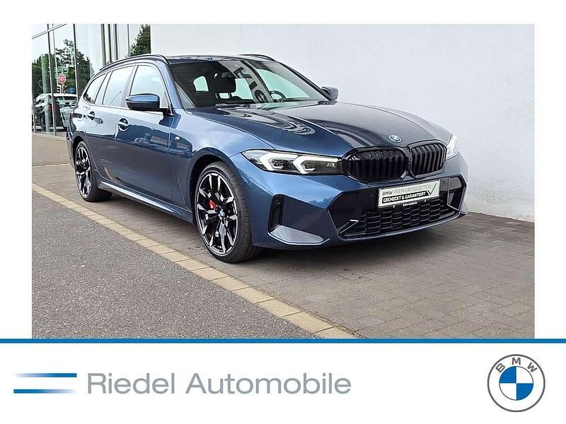 Arctic race blue metallic Gebraucht 2024 BMW 330e M Sport Kombi | 51.890 € (Teuer) - Bild 1/3