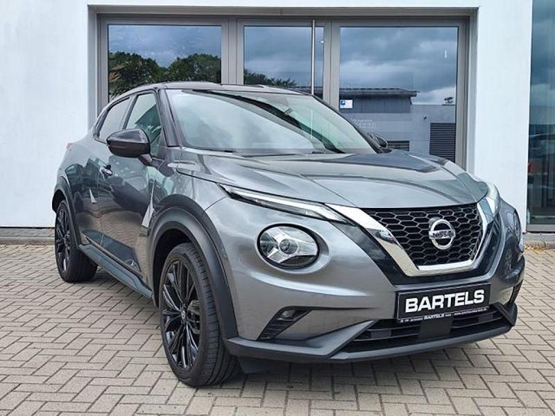Dark grey m/black m (metallic) Gebraucht 2021 Nissan Juke Enigma SUV | 17.940 € (Fairer Preis) - Bild 1/4