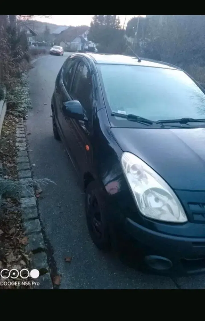 Gebraucht Nissan Pixo 68 PS (50 kW) 2010 Schwarz Kleinwagen