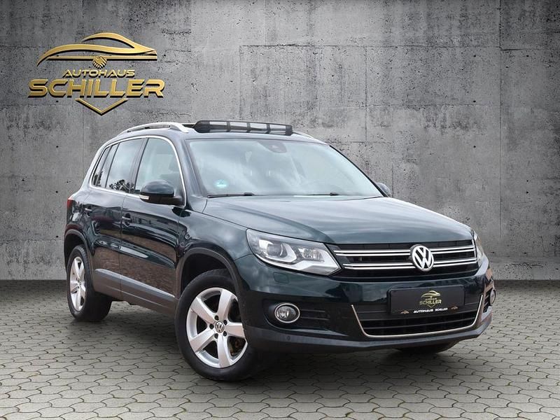 Grün Gebraucht 2014 VW Tiguan Sport SUV | 17.499 € (Etwas zu teuer) - Bild 1/4