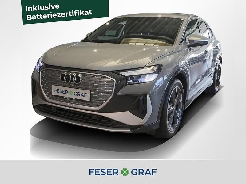Kieselgrau Gebraucht 2023 Audi Q4 Sportback e-tron Comfort SUV | 27.840 € (Fairer Preis) - Bild 1/4