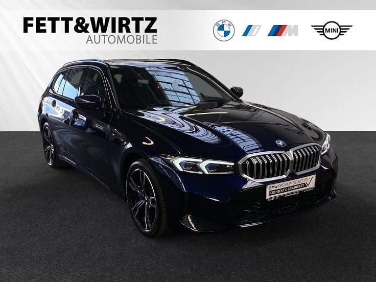 Gebraucht BMW 330e M Sport 292 PS (214 kW) 2024 Bmw individual tansanitblau metallic Kombi