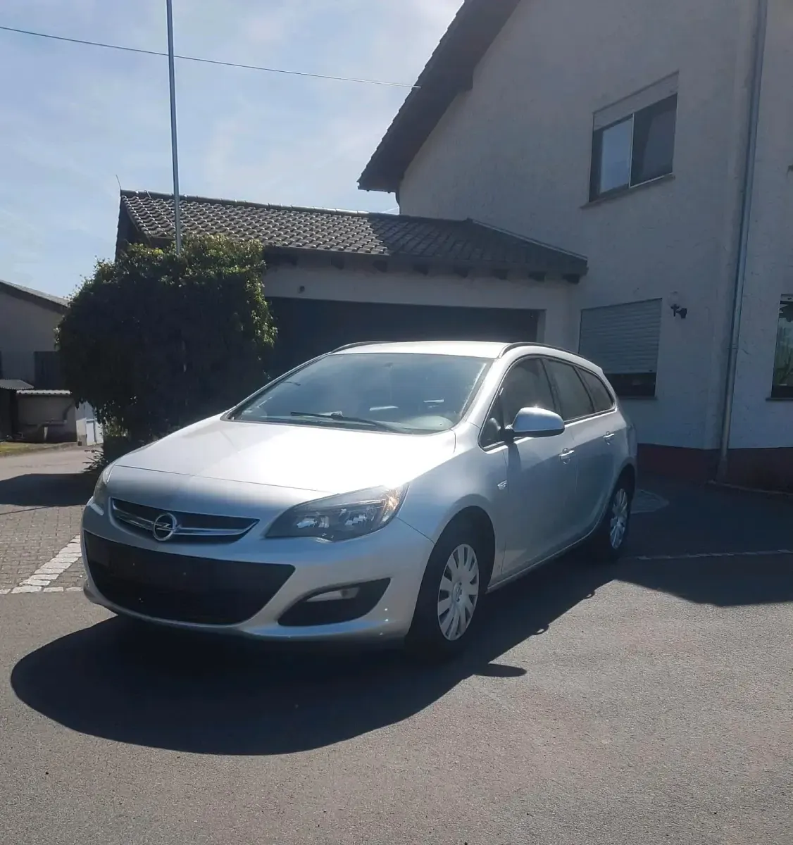 Second-hand Opel Astra 110 CP (80 kW) 2014 Argintiu Break