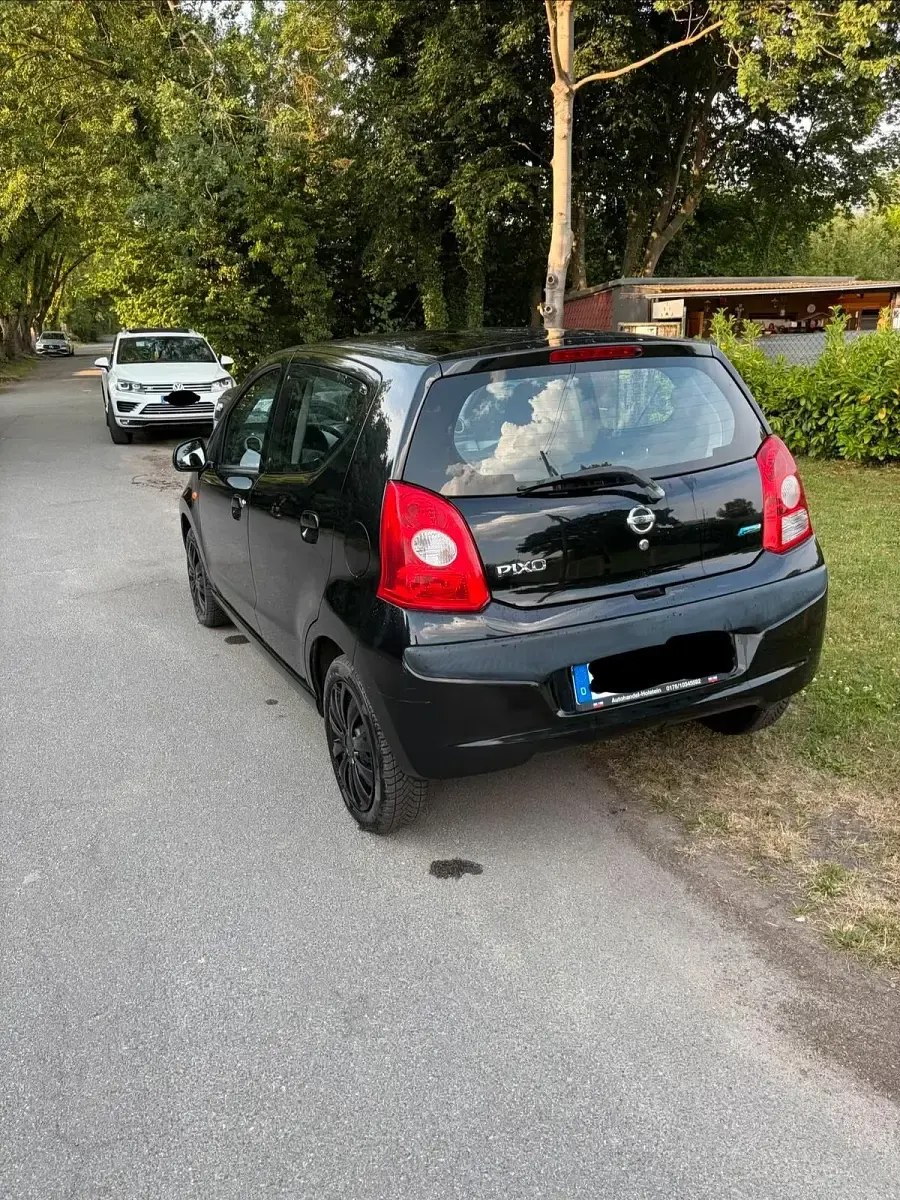 Gebraucht Nissan Pixo 63 PS (46 kW) 2011 Schwarz Kleinwagen