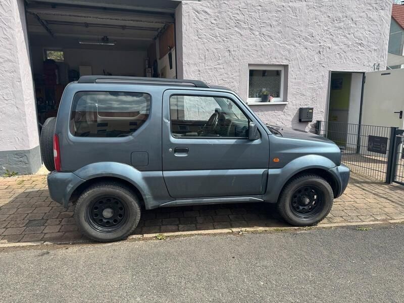 Grau Gebraucht 2006 Suzuki Jimny SUV | 3.999 € (Superpreis) - Bild 1/4