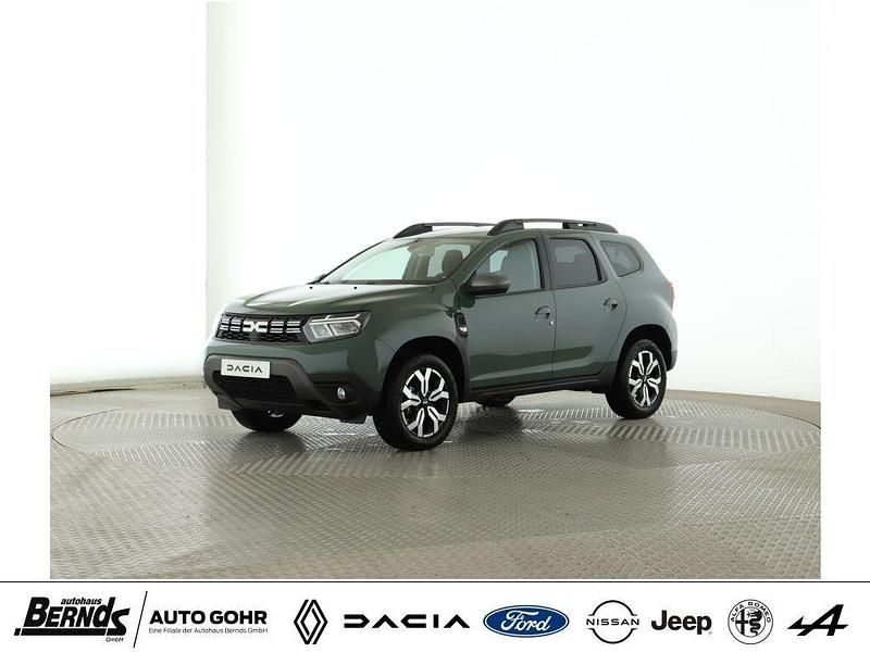Safarigrüngrau met. (kqm) Gebraucht 2024 Dacia Duster Journey SUV | 21.640 € (Guter Preis) - Bild 1/4