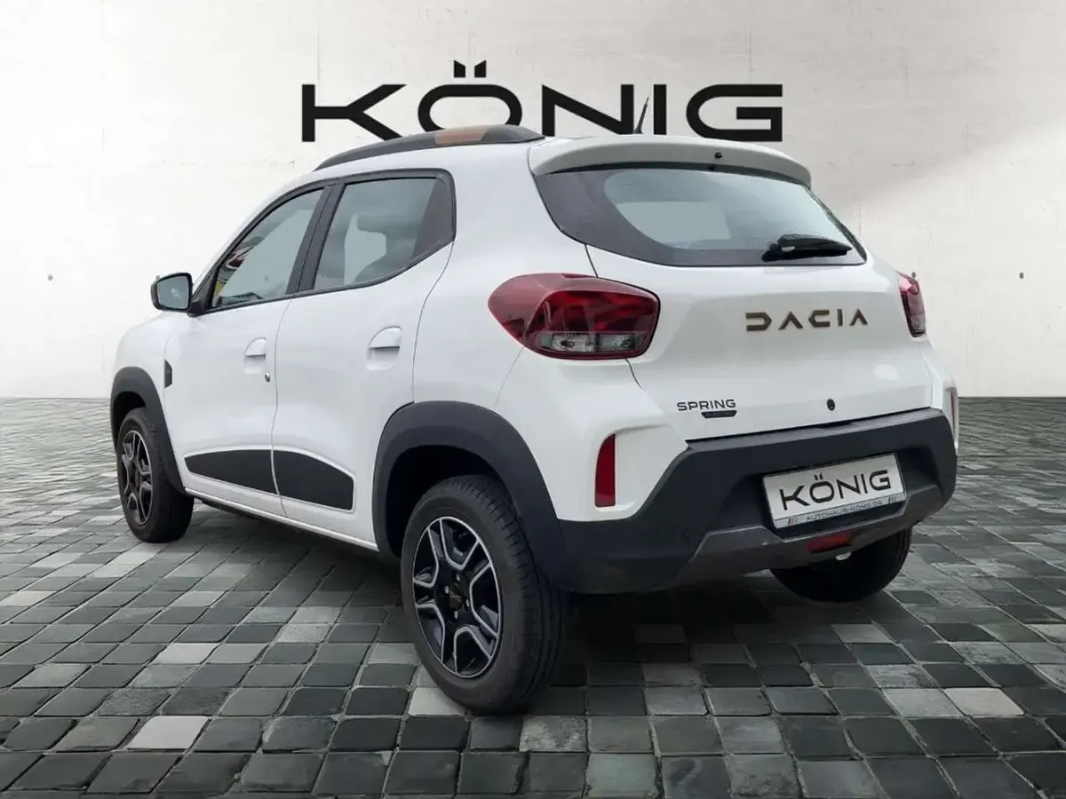 Gebraucht Dacia Spring Extreme 47 kW (65 PS) 2023 Kaolinweiß Kleinwagen