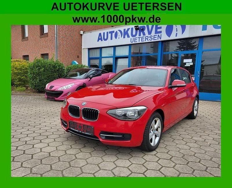 Rot Gebraucht 2013 BMW 118 Sport Line Kleinwagen | 11.250 € (Fairer Preis) - Bild 1/4