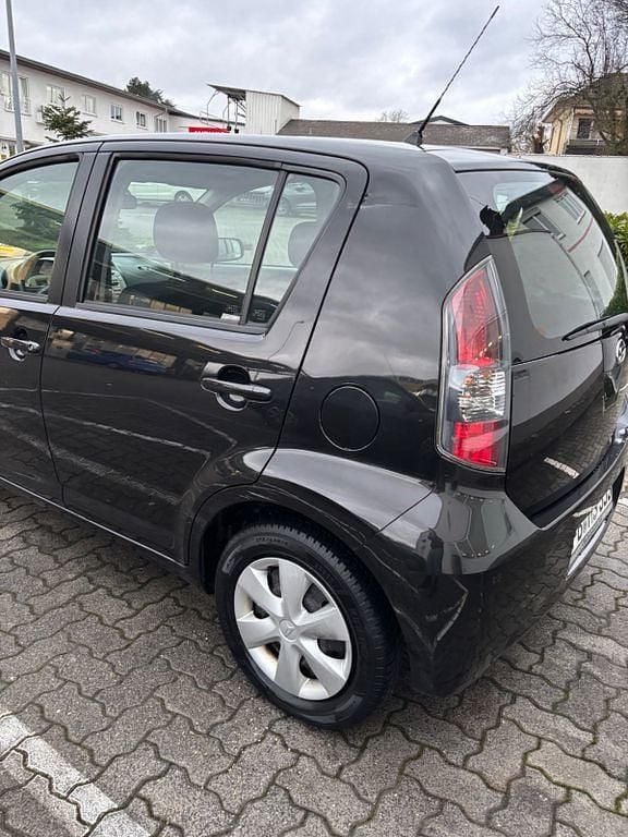 Gebraucht Daihatsu Sirion 69 PS (50 kW) 2009 Schwarz Kleinwagen