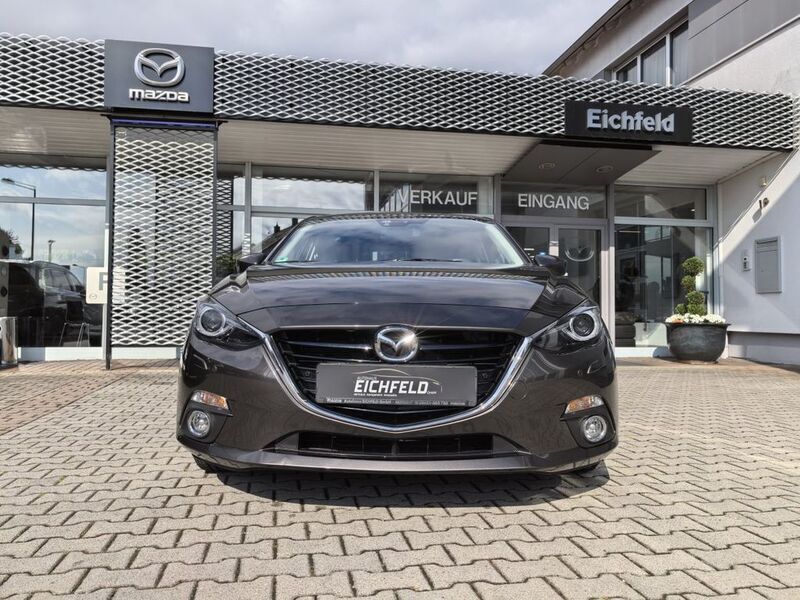 Obsidiangrau metallic Gebraucht 2015 Mazda 3 Limousine | 13.850 € (Etwas zu teuer) - Bild 1/4