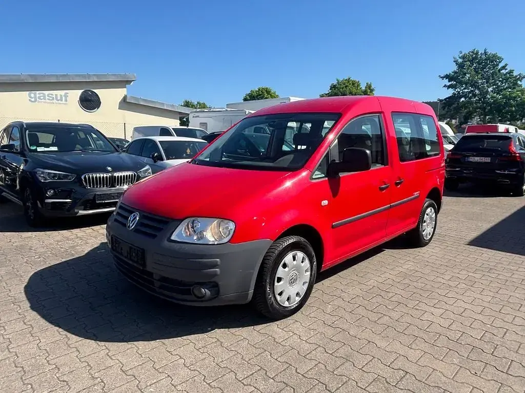 Gebraucht VW Caddy Team 105 PS (77 kW) 2010 Rot Van / Kleinbus