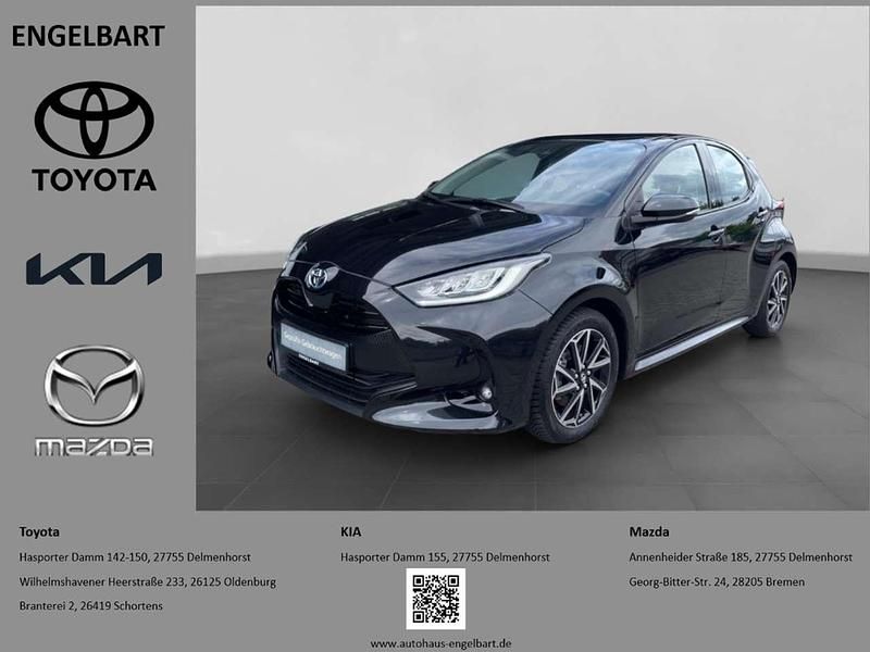 Black mica / ink Gebraucht 2023 Toyota Yaris Hybrid Comfort Kleinwagen | 22.750 € (Fairer Preis) - Bild 1/4