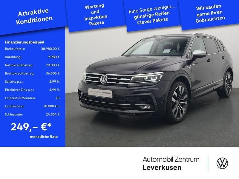Schwarz / deep black (metallic) Gebraucht 2021 VW Tiguan Allspace R-line SUV | 38.980 € (Fairer Preis) - Bild 1/4
