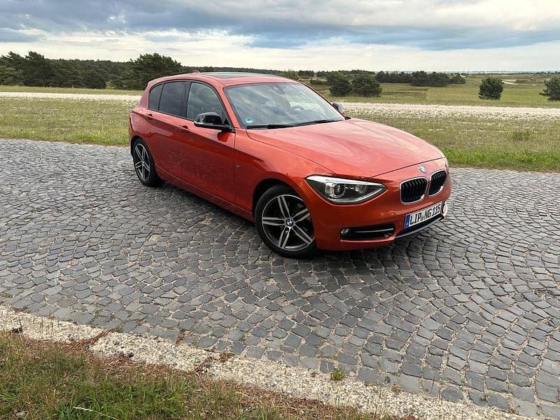 Orange Gebraucht 2012 BMW 120 Sport Line Kleinwagen | 8.900 € (Guter Preis) - Bild 1/4