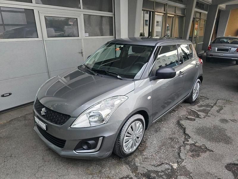 Grau Gebraucht 2015 Suzuki Swift Limousine | 5.999 € (Fairer Preis) - Bild 1/4