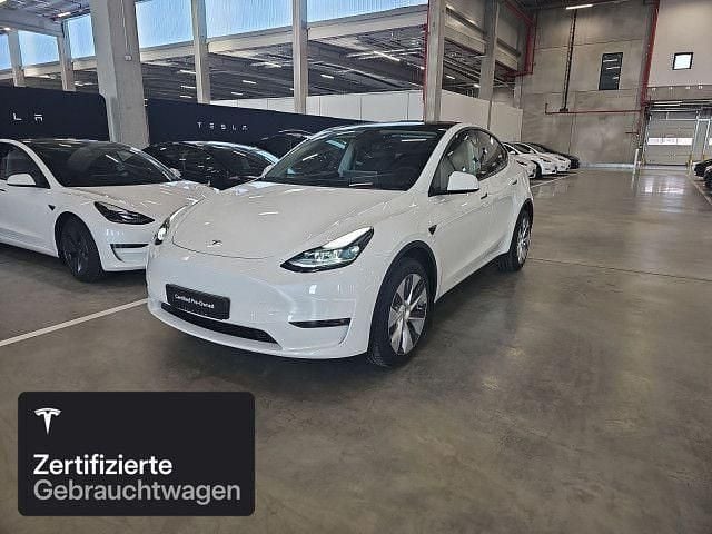 Pearl white multicoat Gebraucht 2023 Tesla Model Y Long Range AWD SUV | 43.700 € (Teuer) - Bild 1/4