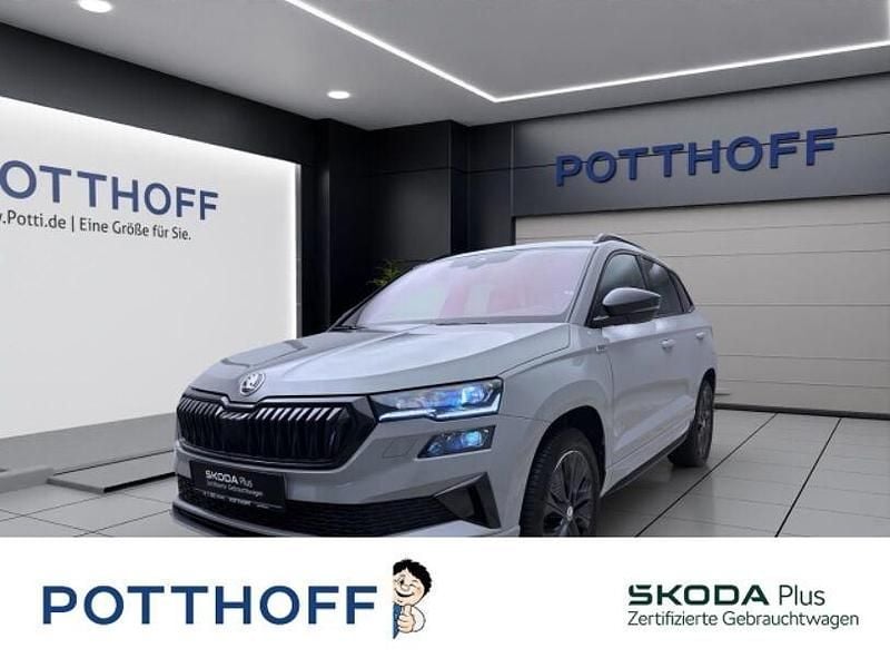 Grau Gebraucht 2024 Skoda Karoq SportLine SUV | 33.997 € (Guter Preis) - Bild 1/4