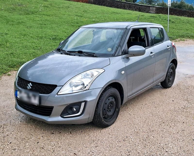 Grau Gebraucht 2015 Suzuki Swift Club Kleinwagen | 5.890 € (Guter Preis) - Bild 1/4