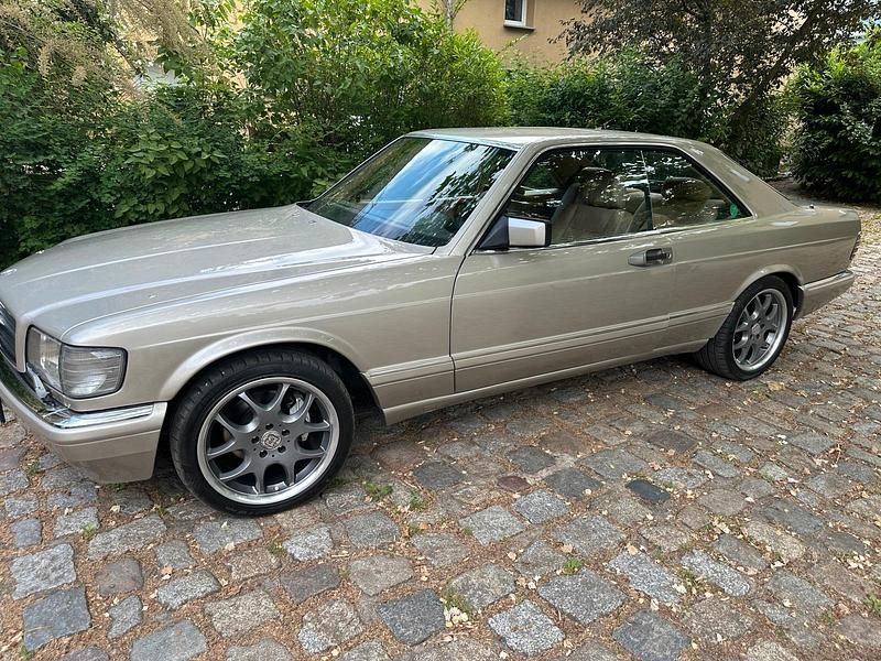 Gold Gebraucht 1987 Mercedes 560 Coupé | 28.000 € - Bild 1/4