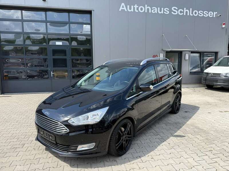 Pantherschwarz metallic Gebraucht 2015 Ford Grand C-Max Titanium Van / Kleinbus | 10.299 € (Fairer Preis) - Bild 1/4