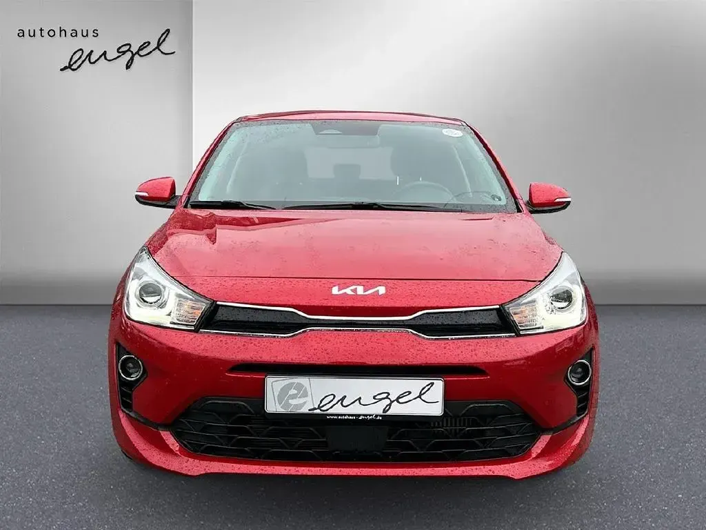 Gebraucht Kia Rio Platinum Edition 120 PS (88 kW) 2023 Signal rot metallic Limousine