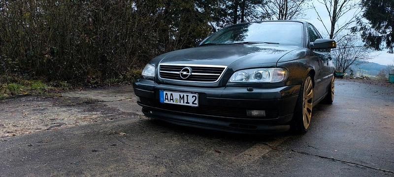 Second-hand Opel Omega 211 CP (155 kW) 2000 Negru Berlinǎ