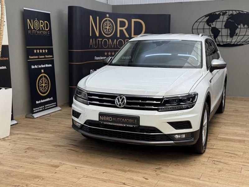 Pure white Gebraucht 2021 VW Tiguan Allspace Highline SUV | 28.989 € (Superpreis) - Bild 1/4