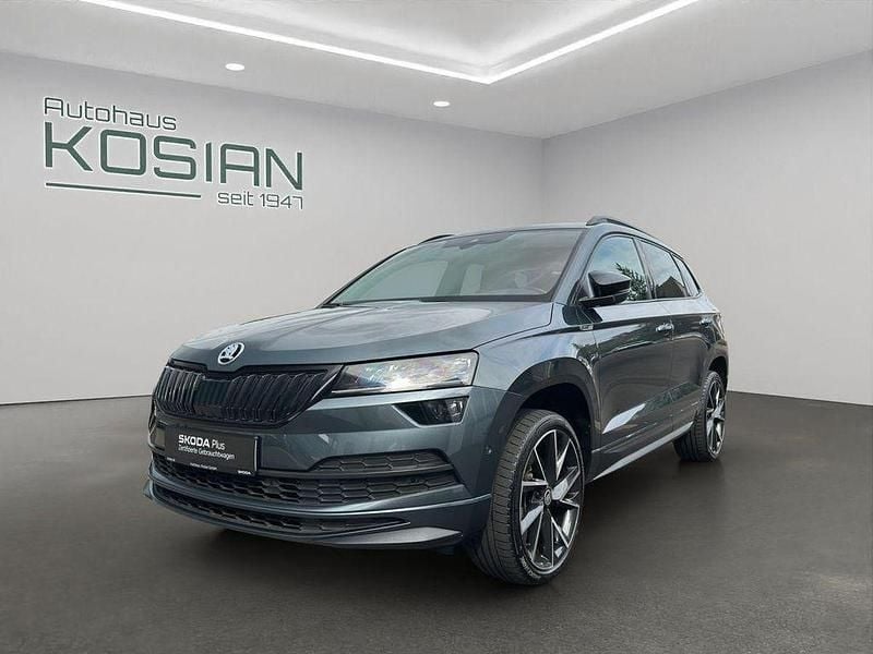 Quarzgrau metallic Gebraucht 2020 Skoda Karoq SportLine SUV | 26.890 € (Teuer) - Bild 1/4