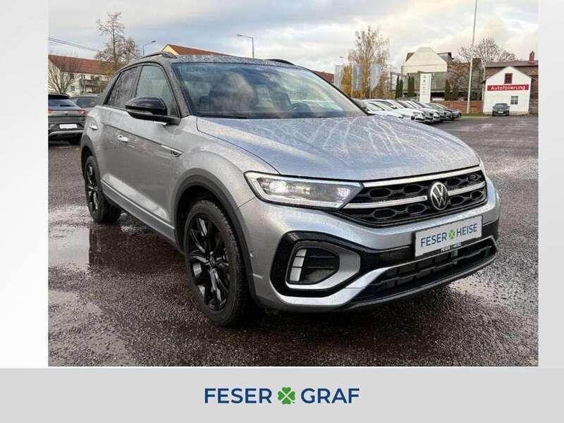 Pyrit silber metallic schwarz Gebraucht 2024 VW T-Roc R-line SUV | 30.980 € (Fairer Preis) - Bild 1/4
